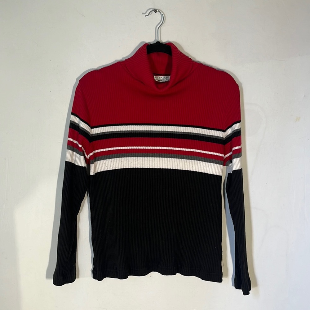 A large Carolyn Taylor stripped multicolored turtle neck sweater.